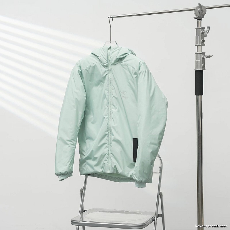 Clean Hooded Profile And Minimal Chest Branding Arc'teryx Lightweight Shell Jacket in Mint Green