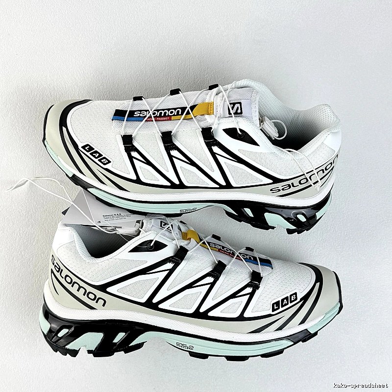 Salomon White and Black Trail Sneakers Highlighting Treaded Trail Sole